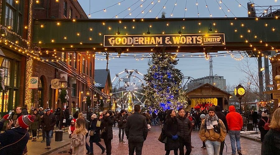 The Distillery District winter market under strings of lights